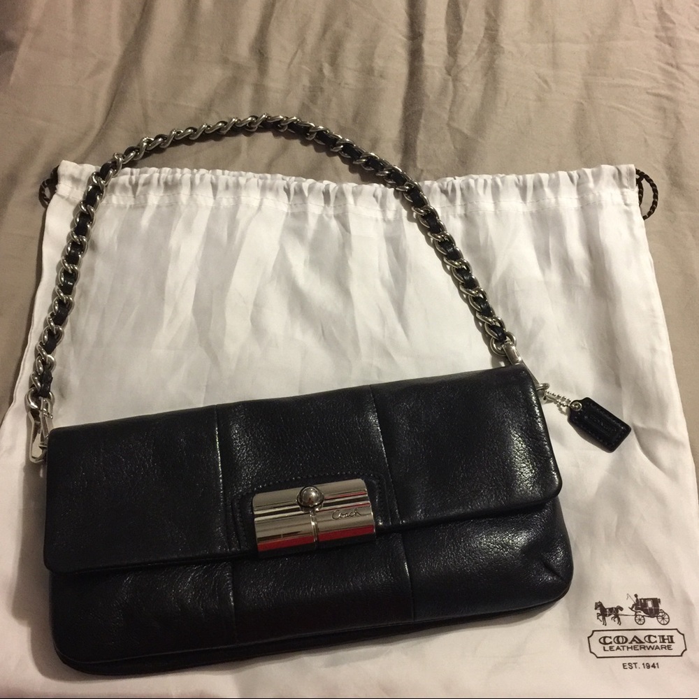 Coach leather clutch/purse with removable strap.