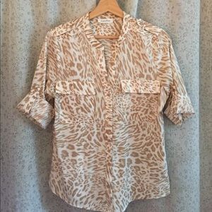 Animal print button up blouse.