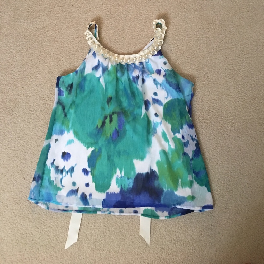 An x-large blouse with pearl detailing.