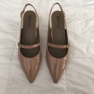 Anyi Lu patent leather pumps.