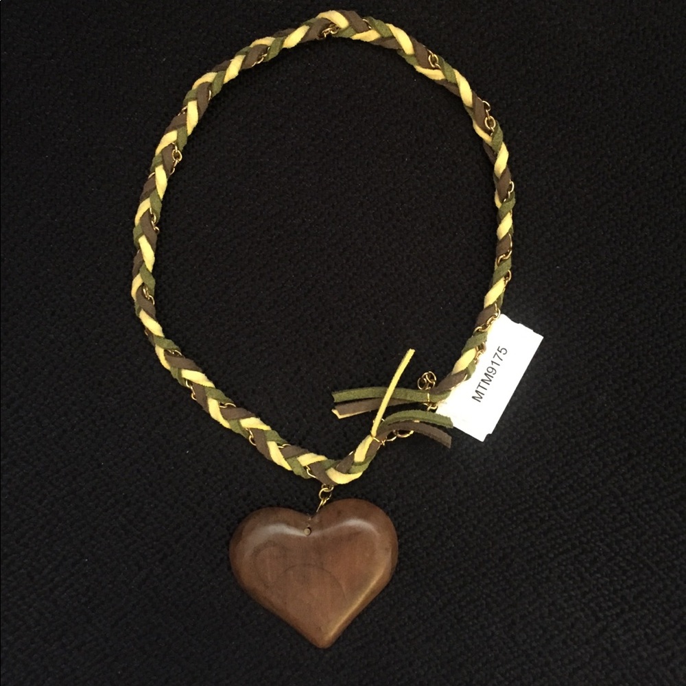 Leather braided wooden heart necklace .