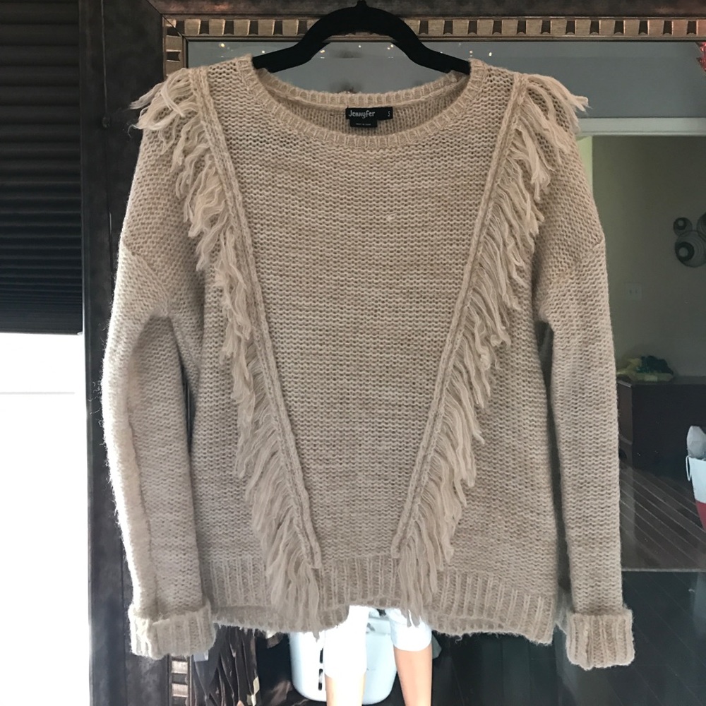 Frayed tan sweater