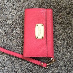 Michael Kors phone case and wallet.