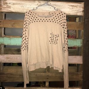 tan and black polka dot shirt