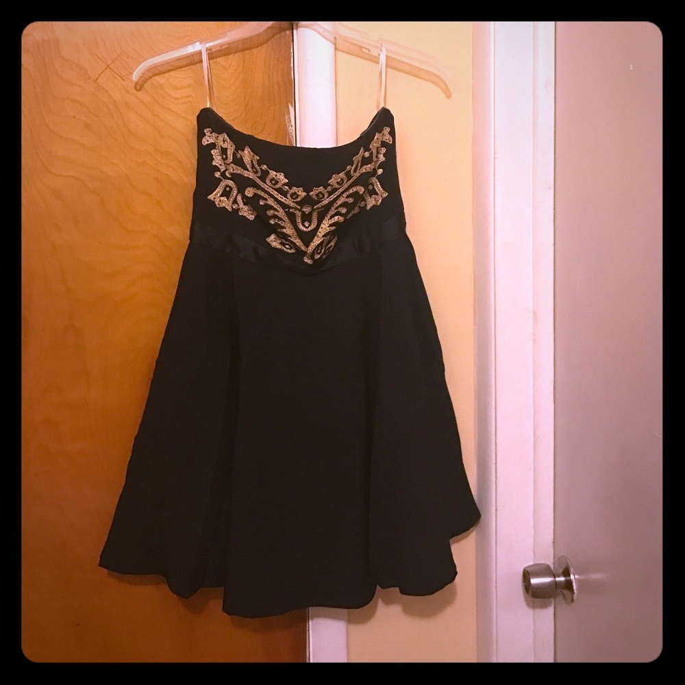 Black dress with gold detailing worn once
