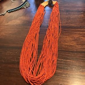 Long burnt orange/ red beaded necklace