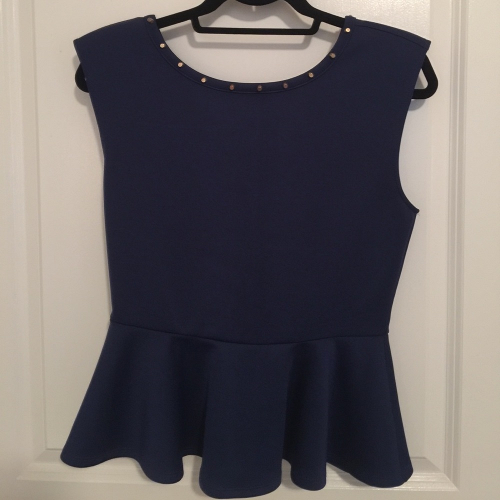 Blue peplum top with studded detail