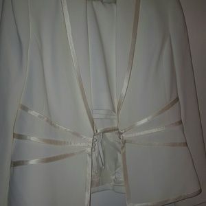 2 white/ off white pant suits. One has some stains