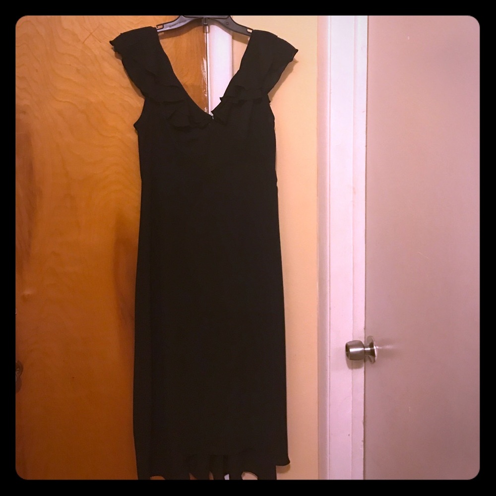 Classy black mid length dress.