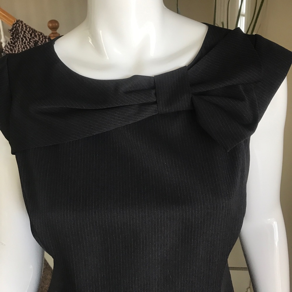 Sandra Darren, designed this classy, black dress.