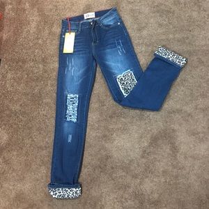 Distressed white leopard skinny