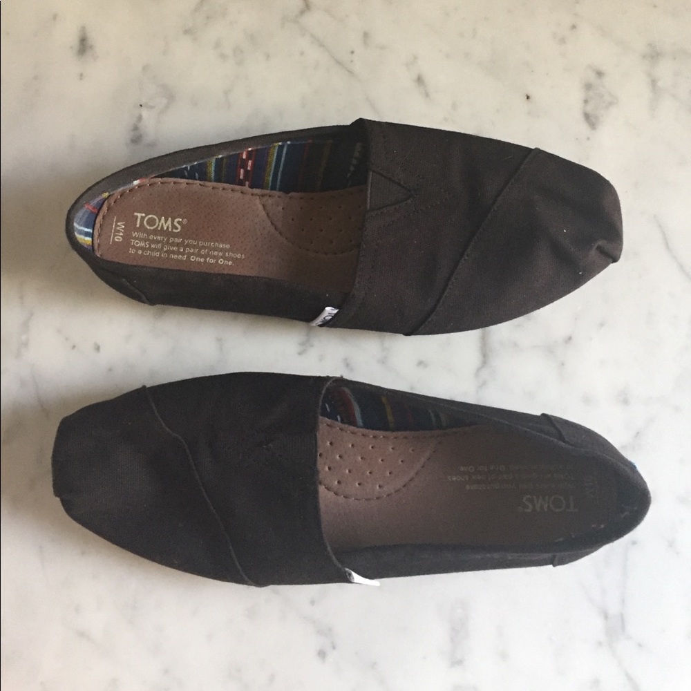 Black slip on Toms, size 10.