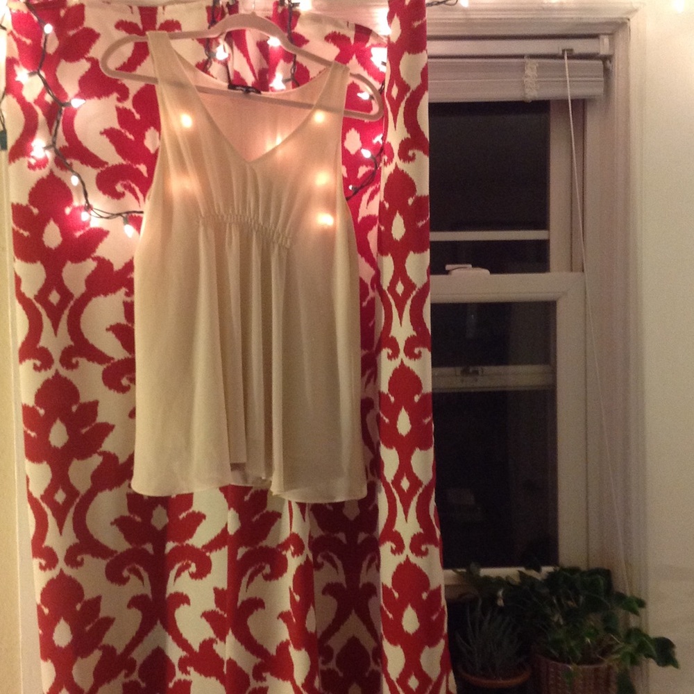 Sleeveless cream blouse