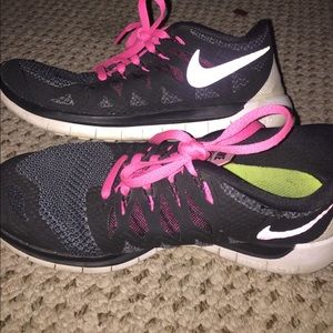 Black & pink Nike Free Runs