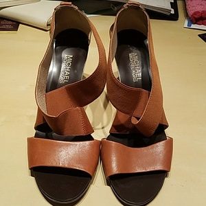 Tan and dark brown sandals by Michael Kors