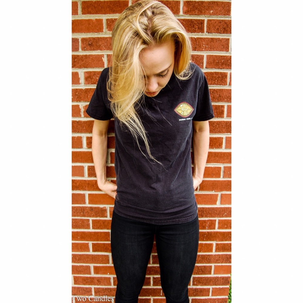 Women's black t shirt with tiki bar logo