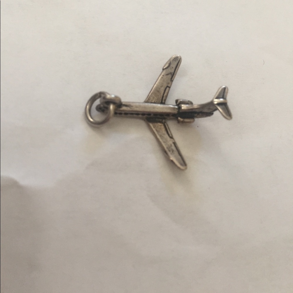 Silver airplane charm