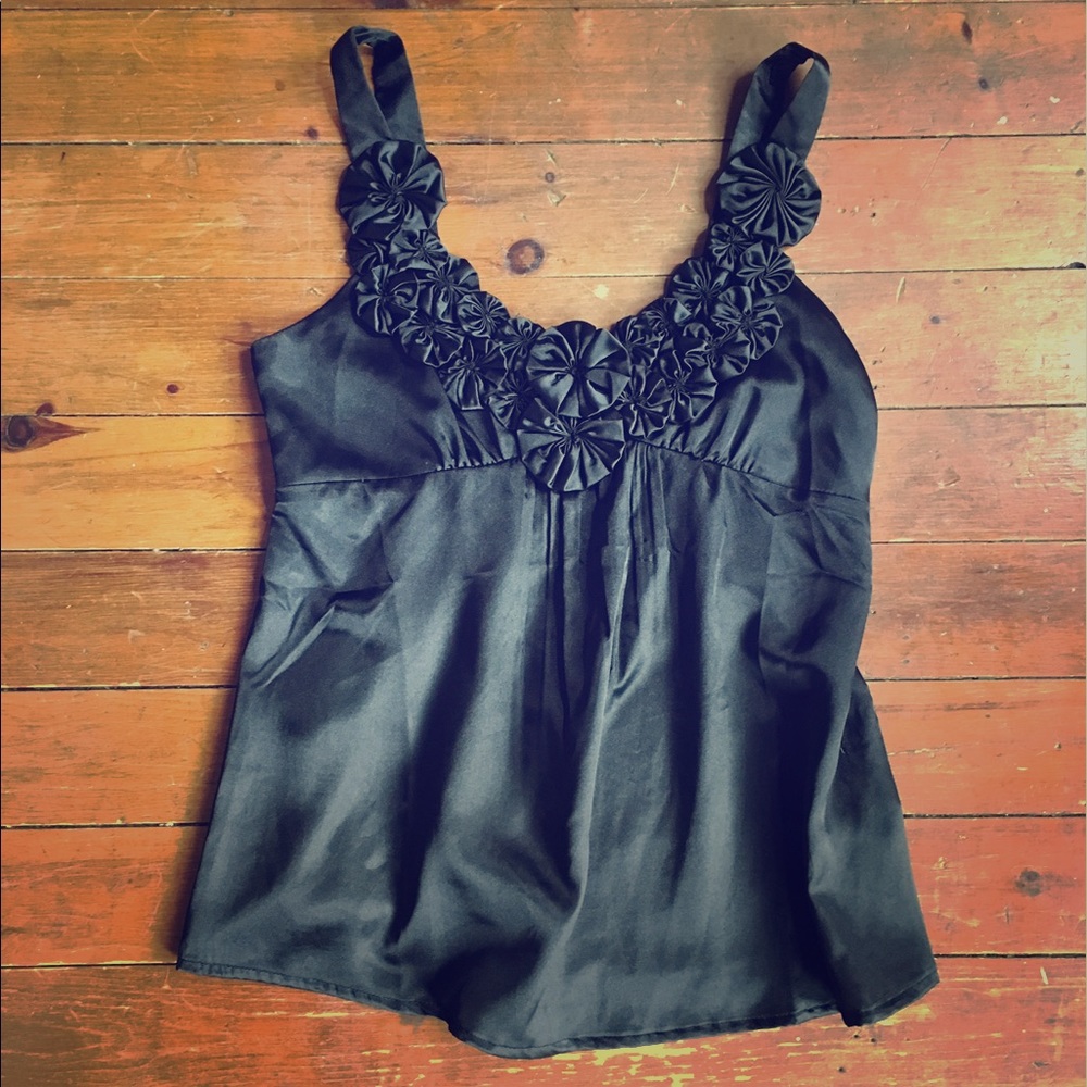 Beautiful silky black top with rosette detail
