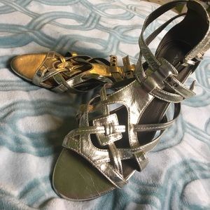 Gold gladiator sandals.