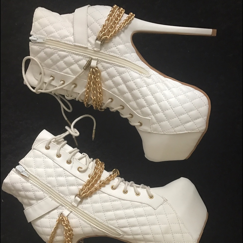 Textured white platform heels with chains attached