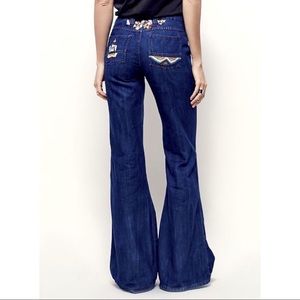 Free People Heartbreaker embroidered bell bottoms.