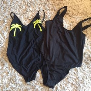 Two black one pieces from Boohoo