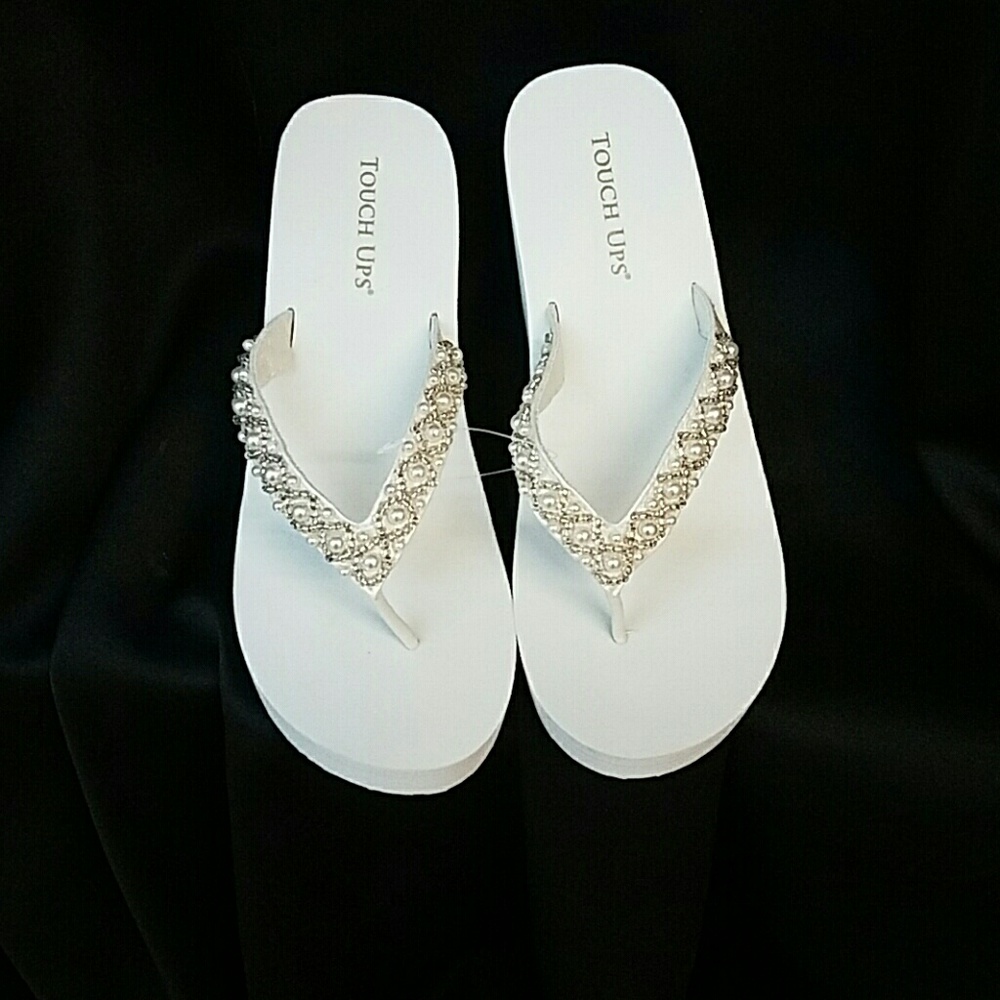 White and ivory wedge flip flops