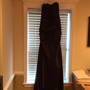 Dark plum floor length strapless gown.