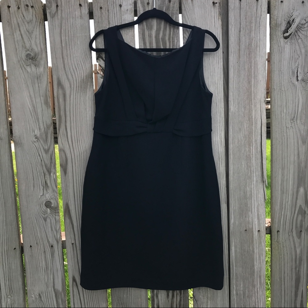 Black evening dress with knot detail in the front.