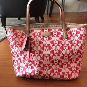 Small pink COACH leather tote. Comes with strap.