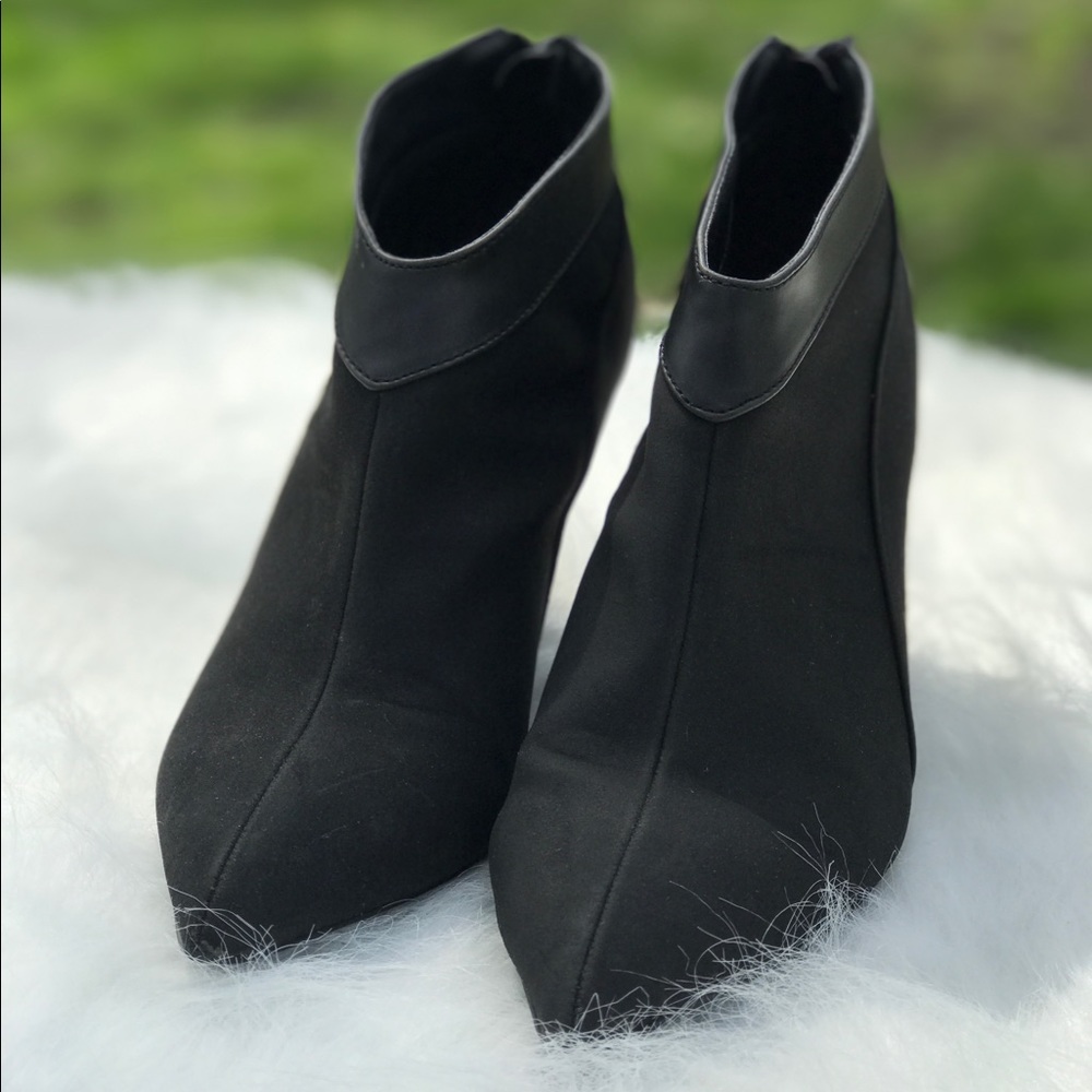 Pointy black wedge booties