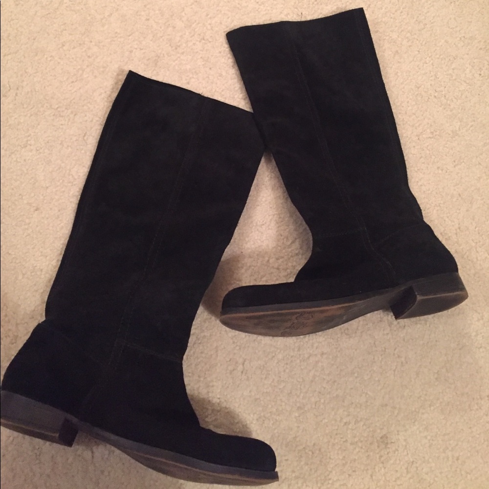 Black suede boots; tall.