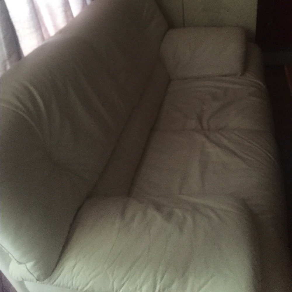 A white leather sofa two seater