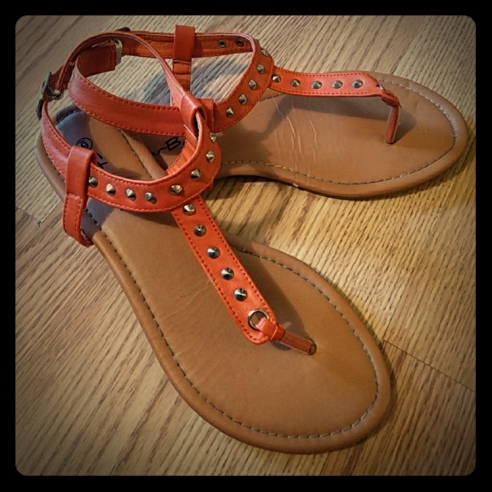 Orange stud gladiator shoes