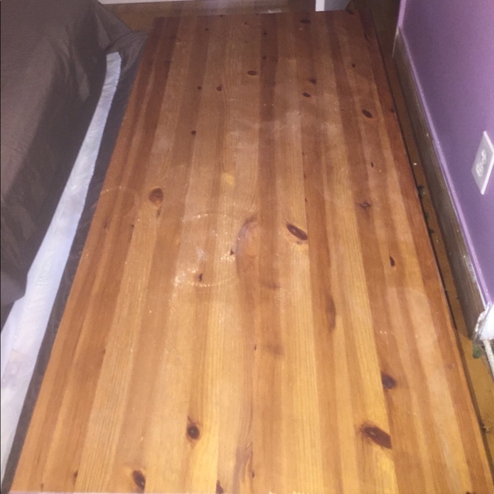 Wooden table with open cabinets