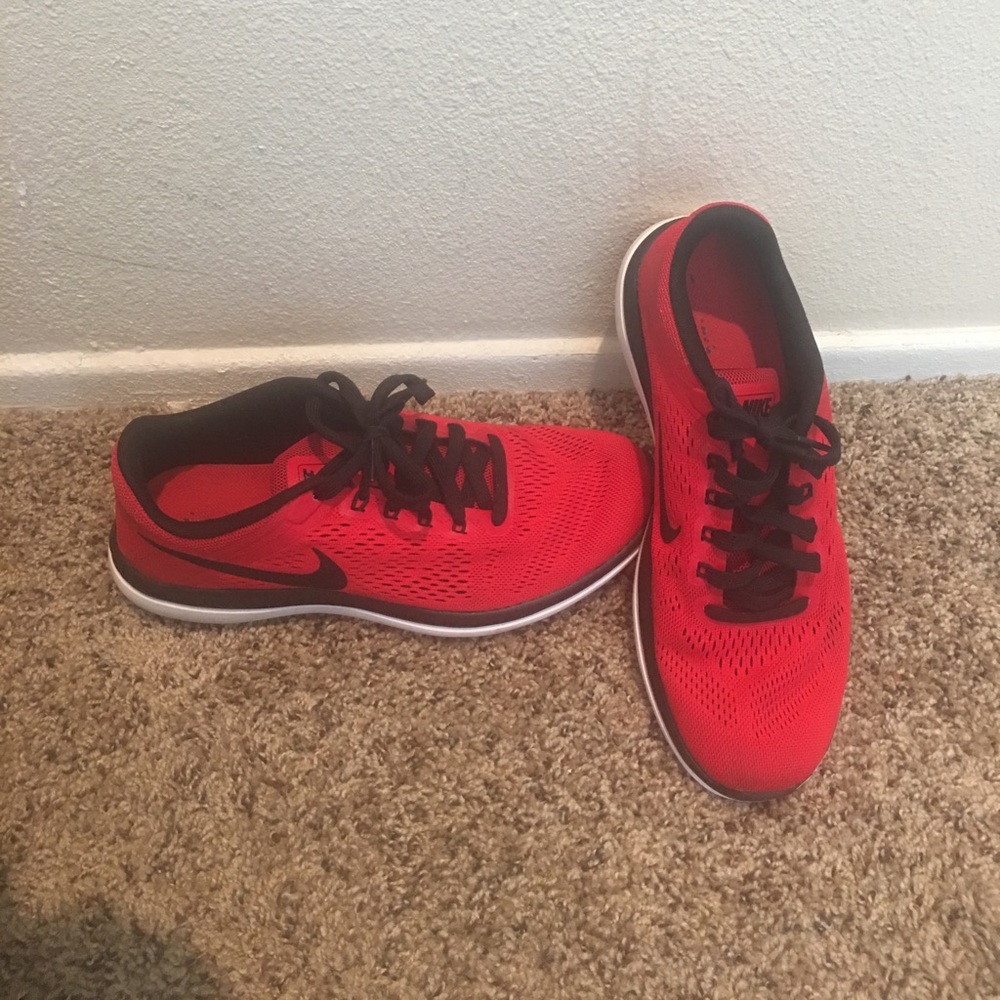 Red and black Nike running shoes