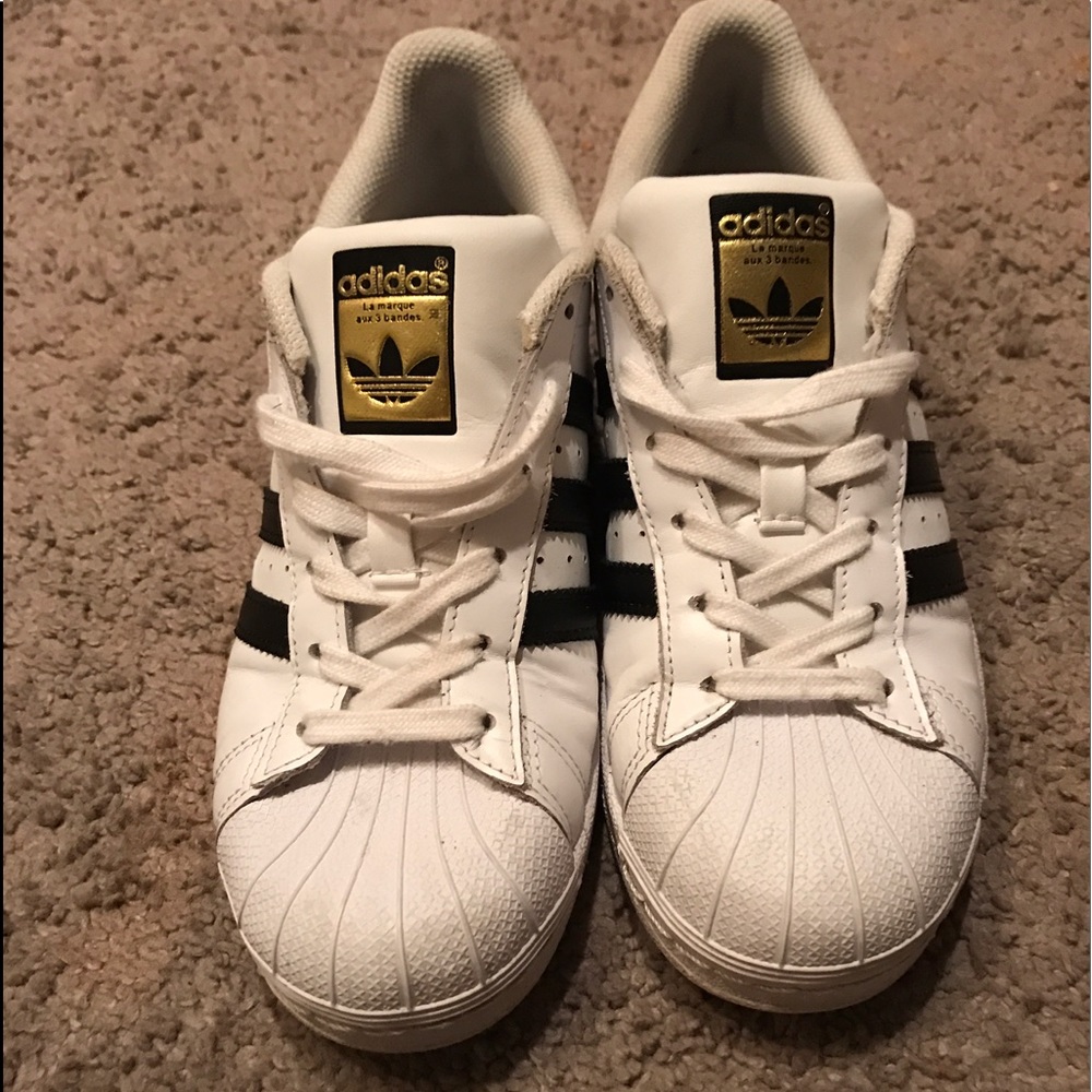 Adidas black Superstars.