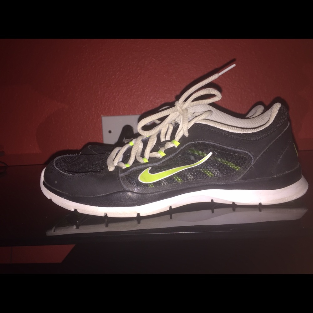 Black and Yellow Nike tennis shoes.