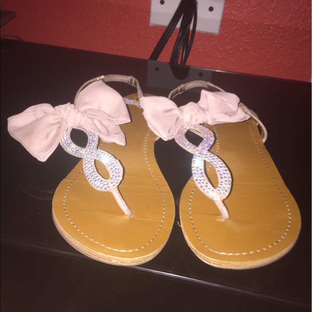 Light Pink straps with studs and big bow.