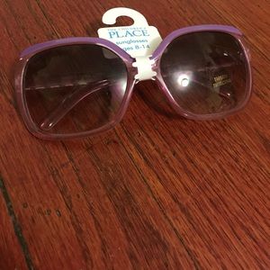 Purple sunglasses with wider lenses. Brand new!