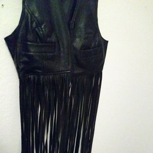 Trendy leather fringe vest.