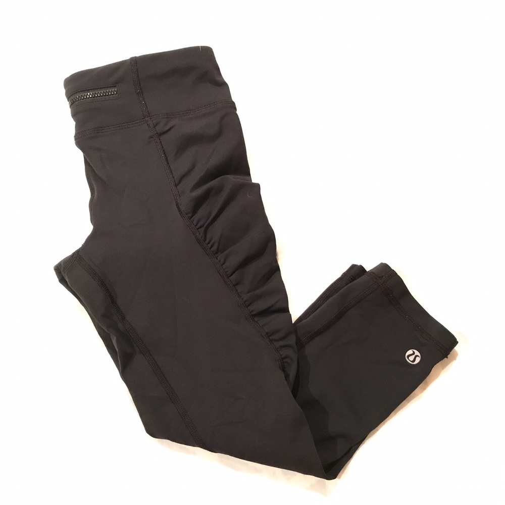Black lululemon yoga pants, crop length.