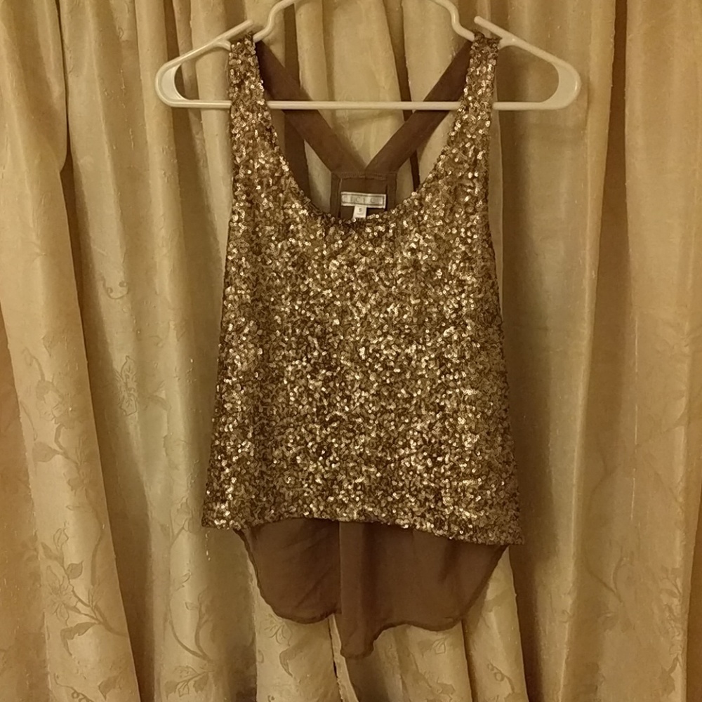 Gold sequin top with a sheer back