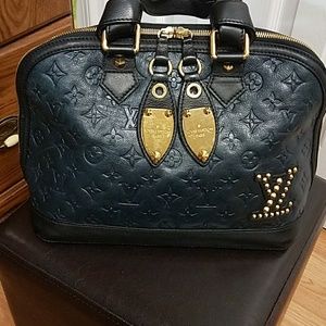 Beautiful blue black leathet louis vuitton bag.