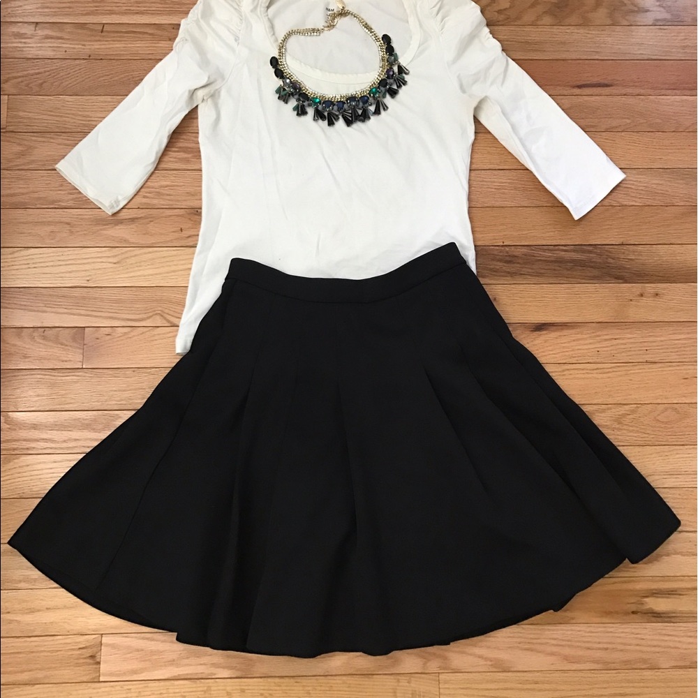 Ponte pleated skirt made from scuba material.