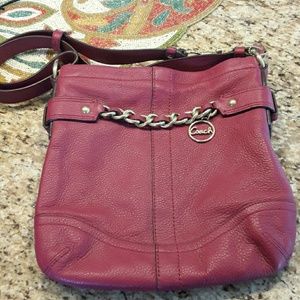 Burgundy coach purse. Never used!