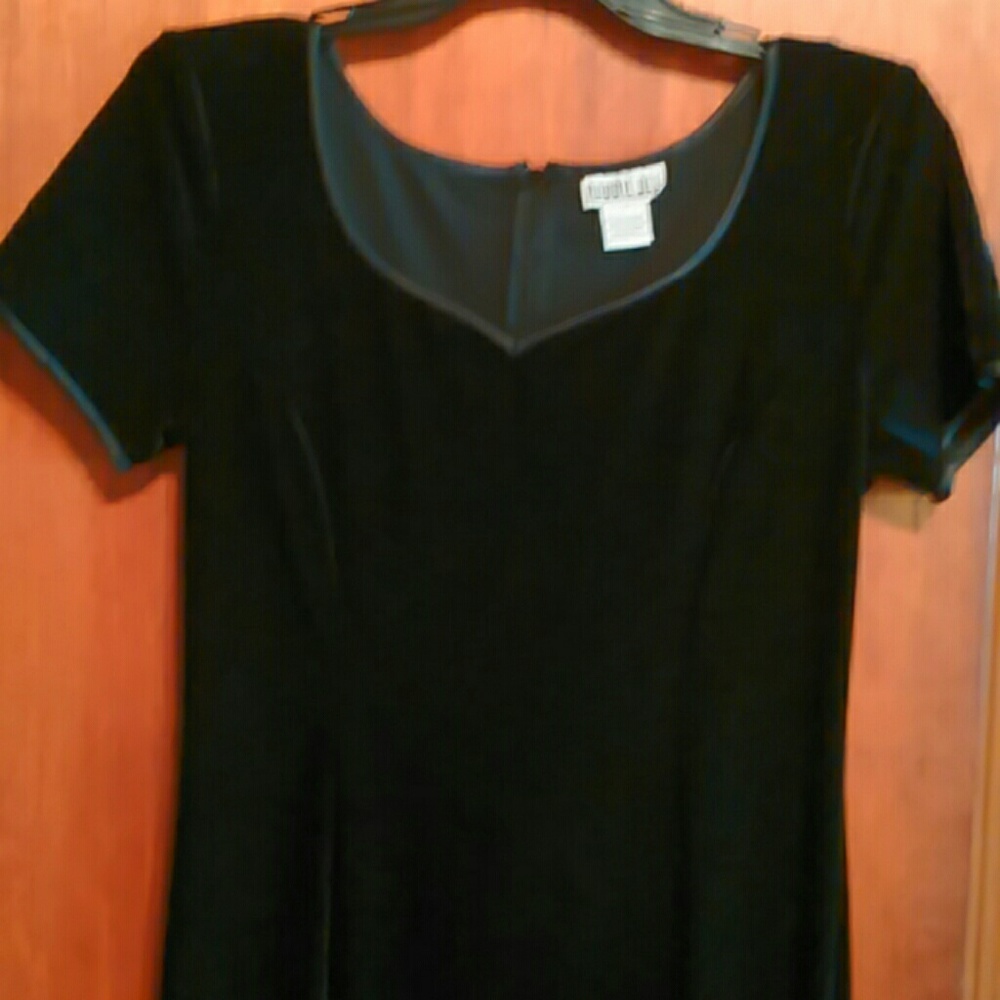 Calf length black dress.