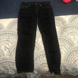 Black extremely ripped jeans