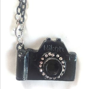 Black Nikon camera necklace