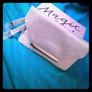 New in pkg-Illuminating Silver Jeweled Clutch 
